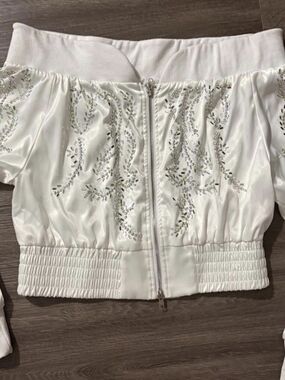 White Embellished Off-Shoulder Zip Front Top
